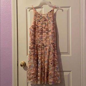 Pink skater dress with halter neckline and flowers
